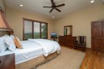 Primary Bedroom with King-Sized Bed, TV, Ensuite Bathroom and Mountain Views
